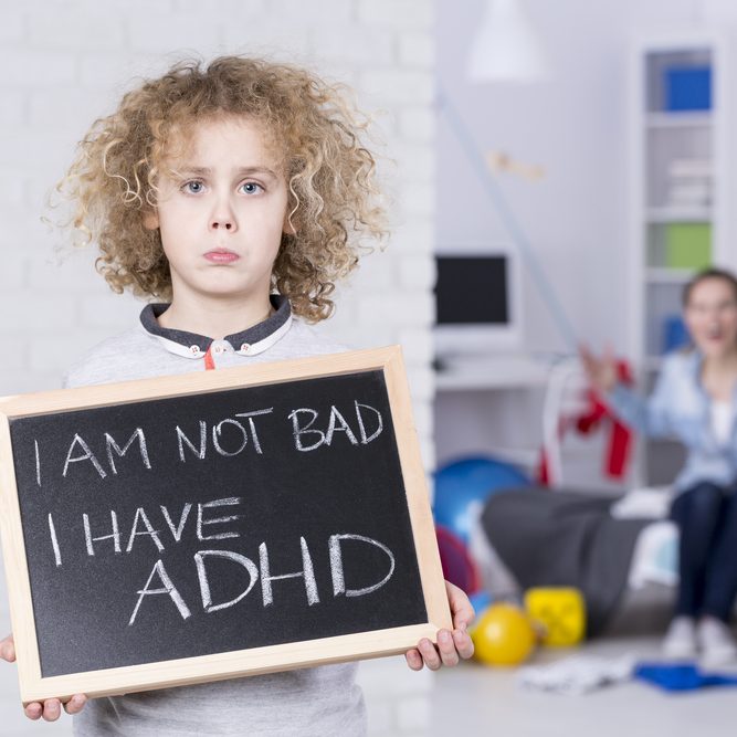 Sad,Adhd,Boy,Holding,Small,Board,,Shouting,Mother,In,Background